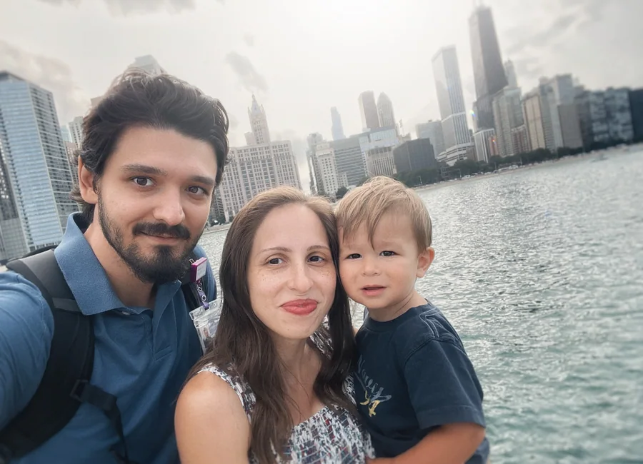 Dr. Dan Serban and his family with the Chicago skyline behind them