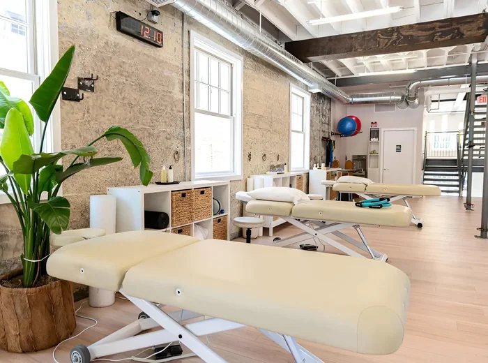 Brick-walled treatment room with a table and potted plant